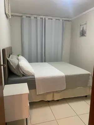 Uma cama ou camas num quarto em Casa com piscina
