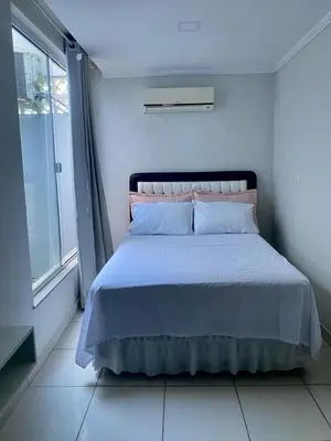 Uma cama ou camas num quarto em Casa com piscina