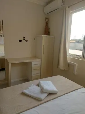 Uma cama ou camas num quarto em Lindo Apartamento 2 Quartos 5 min da Praia de BC