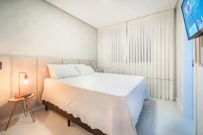 Uma cama ou camas num quarto em 665 - Belíssimo Apartamento na Praia de Bombas