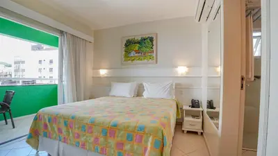 Uma cama ou camas num quarto em Pousada Vila do Coral