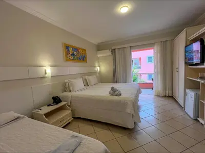 Uma cama ou camas num quarto em Pousada Vila do Coral
