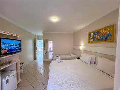Uma cama ou camas num quarto em Pousada Vila do Coral