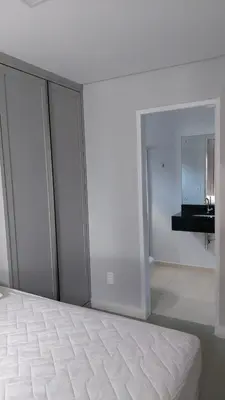 Uma cama ou camas num quarto em Apartamento Frente Mar em Porto Belo