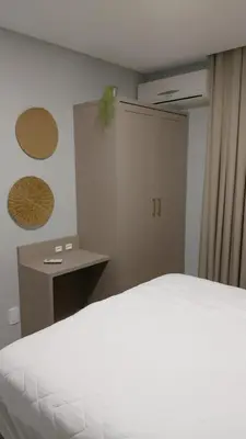 Uma cama ou camas num quarto em Apartamento Frente Mar em Porto Belo