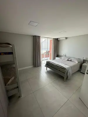 Uma cama ou camas num quarto em Apartamento Frente Mar em Porto Belo