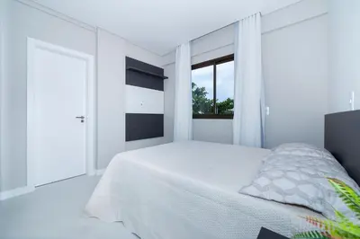 Uma cama ou camas num quarto em Aluguel Apartamento com 2 Suítes