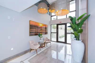 Uma área de estar em Aluguel Apartamento com 2 Suítes
