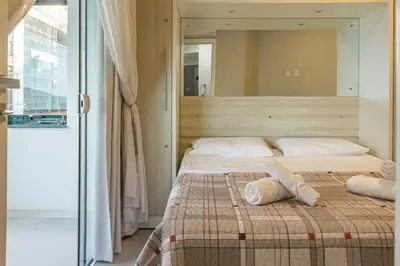 Uma cama ou camas num quarto em Apto em condomínio Pé na Areia em Itapema N1672