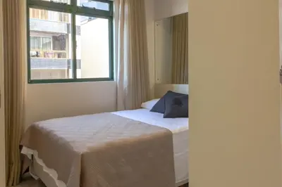 Uma cama ou camas num quarto em Apto em condomínio Pé na Areia em Itapema N1672