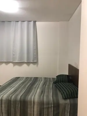 Uma cama ou camas num quarto em Apartamento funcional na Praia de Palmas Governador Celso Ramos