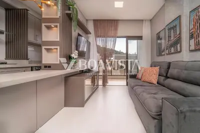 Uma televisão e/ou sistema de entretenimento em Aluguel Apartamento Sunrise 2 suítes