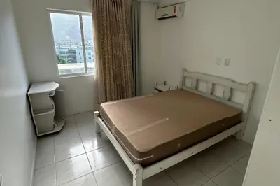 Uma cama ou camas num quarto em Cobertura com piscina e vista mar