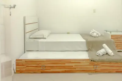 Uma cama ou camas num quarto em Com garagem e banheira a 150m da praia N1188