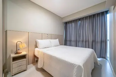 Uma cama ou camas num quarto em Apartamento com duas suítes no centro de Bombinhas