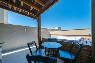 Uma varanda ou terraço em Lindo Duplex na Praia de Canto Grande com ótima localização