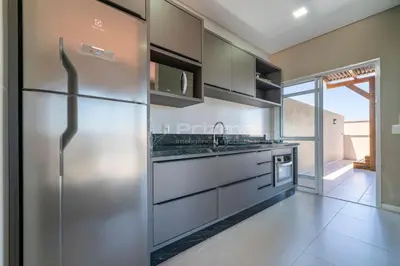 A cozinha ou kitchenette de Lindo Duplex na Praia de Canto Grande com ótima localização