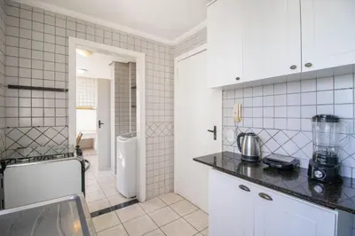 A cozinha ou kitchenette de DCA51 - Pé na areia, Churrasqueira, 2 Garagens
