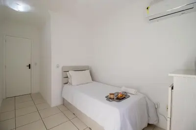 Uma cama ou camas num quarto em WAL51 - Churrasq, Quadra Mar, 3 Dorm, Climatizado