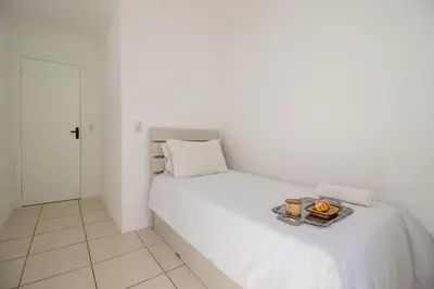 Uma cama ou camas num quarto em WAL51 - Churrasq, Quadra Mar, 3 Dorm, Climatizado