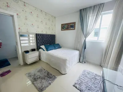 Uma cama ou camas num quarto em Cobertura Infinity Blue - Itapema/SC