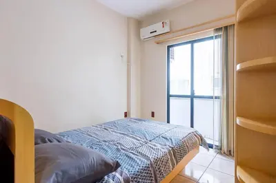 Uma cama ou camas num quarto em Itapema Beira Mar
