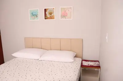 Uma cama ou camas num quarto em Enseada de Zimbros Residencial