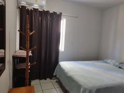 Uma cama ou camas num quarto em Apartamento de Praia no Centro