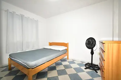 Uma cama ou camas num quarto em Residencial Melfi 2 Apartamento com Piscina
