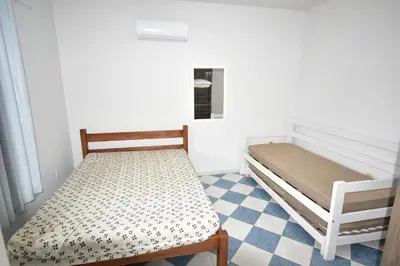 Uma cama ou camas num quarto em Residencial Melfi 2 Apartamento com Piscina