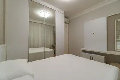 Uma cama ou camas num quarto em Varandas do Atlântico - Apartamento em Condomínio Pé na Areia