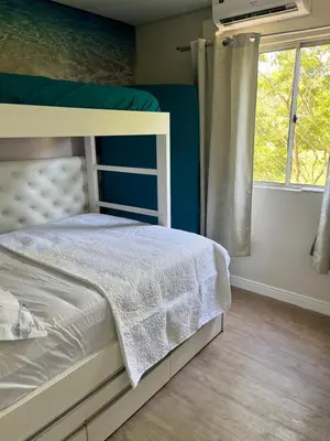 Uma cama ou camas num quarto em Aconchego azul do mar