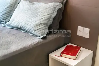 Uma cama ou camas num quarto em Mario Guilherme - Apto - 303 - Lindo apartamento condomínio de alto padrão com piscina e academia.