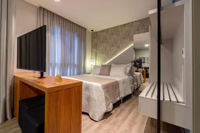 Uma cama ou camas num quarto em Aion 103 - Apto mono ambiente - 50 metros do mar!