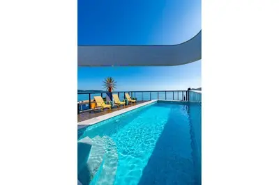 A piscina em ou perto de Aion 104 - Flat c/ cozinha - 50 metros da praia
