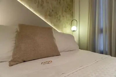 Uma cama ou camas num quarto em Aion 104 - Flat c/ cozinha - 50 metros da praia
