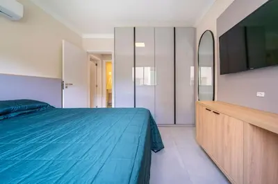 Uma cama ou camas num quarto em Positano 206 - Apto 02 suítes à 50 metros da Praia de 4 Ilhas