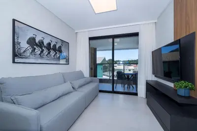Uma televisão e/ou sistema de entretenimento em Adra 103 - 3 Quartos - 2 Vagas de Garagem | Centro de Bombinhas
