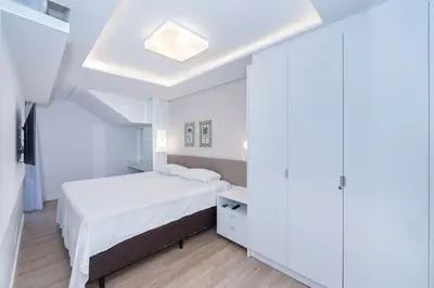 Uma cama ou camas num quarto em Varandas do Atlântico 01A – Frente Mar em Bombas