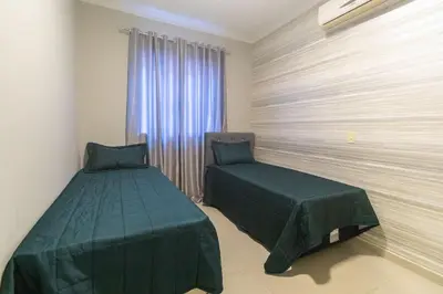 Uma cama ou camas num quarto em Palazzo Toscano 201 - Apto 3 quartos à 100 metros da praia de Bombas