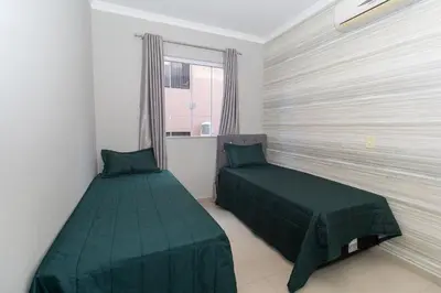 Uma cama ou camas num quarto em Palazzo Toscano 201 - Apto 3 quartos à 100 metros da praia de Bombas