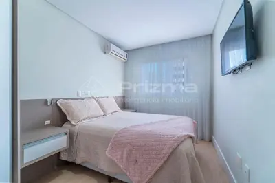 Uma cama ou camas num quarto em Boulevard 123 D - Apartamento com 3 dormitórios em elegante condomínio com piscina aquecida na praia do centro de Bombinhas
