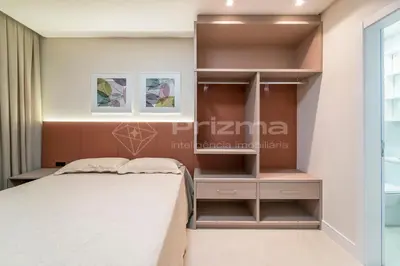 Uma cama ou camas num quarto em 306 Bl 03 - WaldGarten Bombinhas - 50 m do Mar e Frente Avenida - Condomínio de Alto Padrão - Piscina - Academia - Salão de jogos