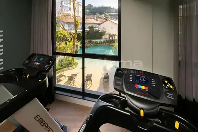 O centro de fitness e/ou as comodidades de fitness de 306 Bl 03 - WaldGarten Bombinhas - 50 m do Mar e Frente Avenida - Condomínio de Alto Padrão - Piscina - Academia - Salão de jogos