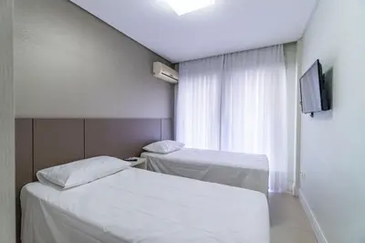 Uma cama ou camas num quarto em Boulevard - Apartamento em Condominio com Piscina