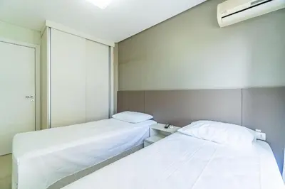 Uma cama ou camas num quarto em Boulevard - Apartamento em Condominio com Piscina