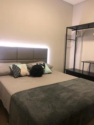 Uma cama ou camas num quarto em Casa de Férias com Piscina em Bombinhas