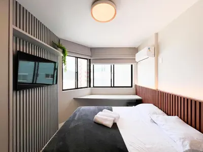 Uma cama ou camas num quarto em Excelente AP Pé na areia Vista mar