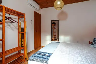 Uma cama ou camas num quarto em Praia do Estaleiro-BC, 2 vagas, Ar, Churras e Pet Friendly