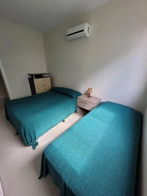 Uma cama ou camas num quarto em Yasmin